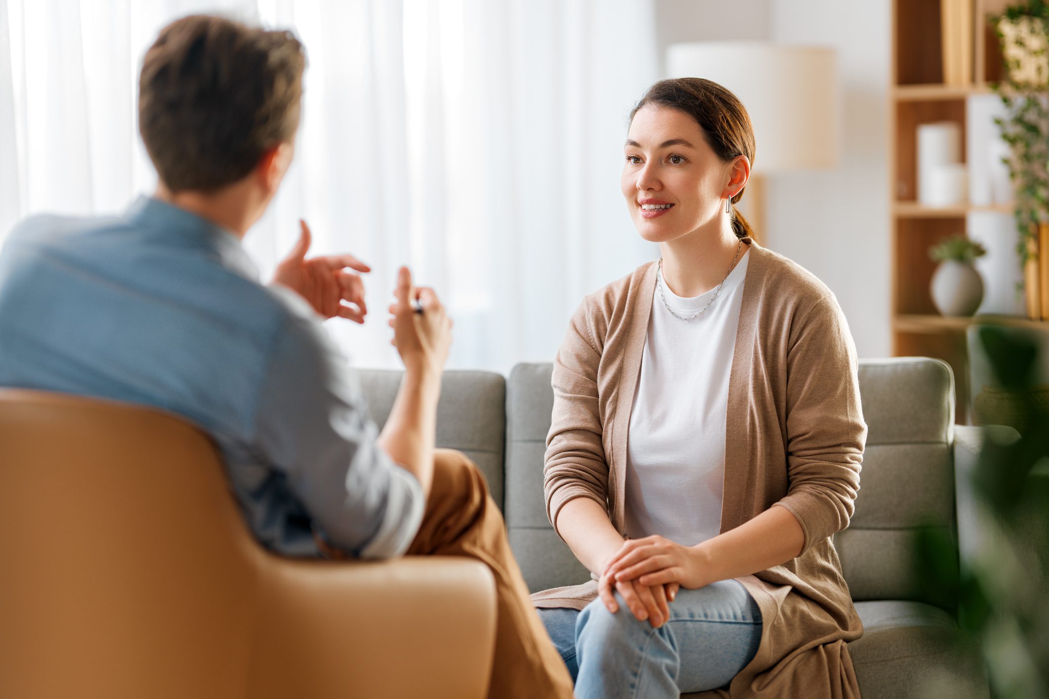 Consultation of young female patient on reception for psychologist.