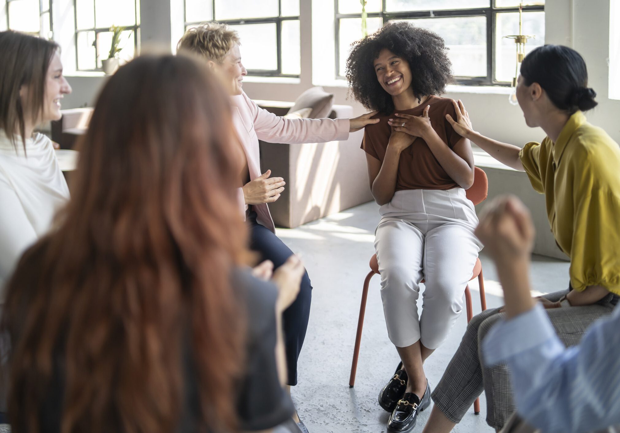 A happy Afro-american woman in a psychological circle